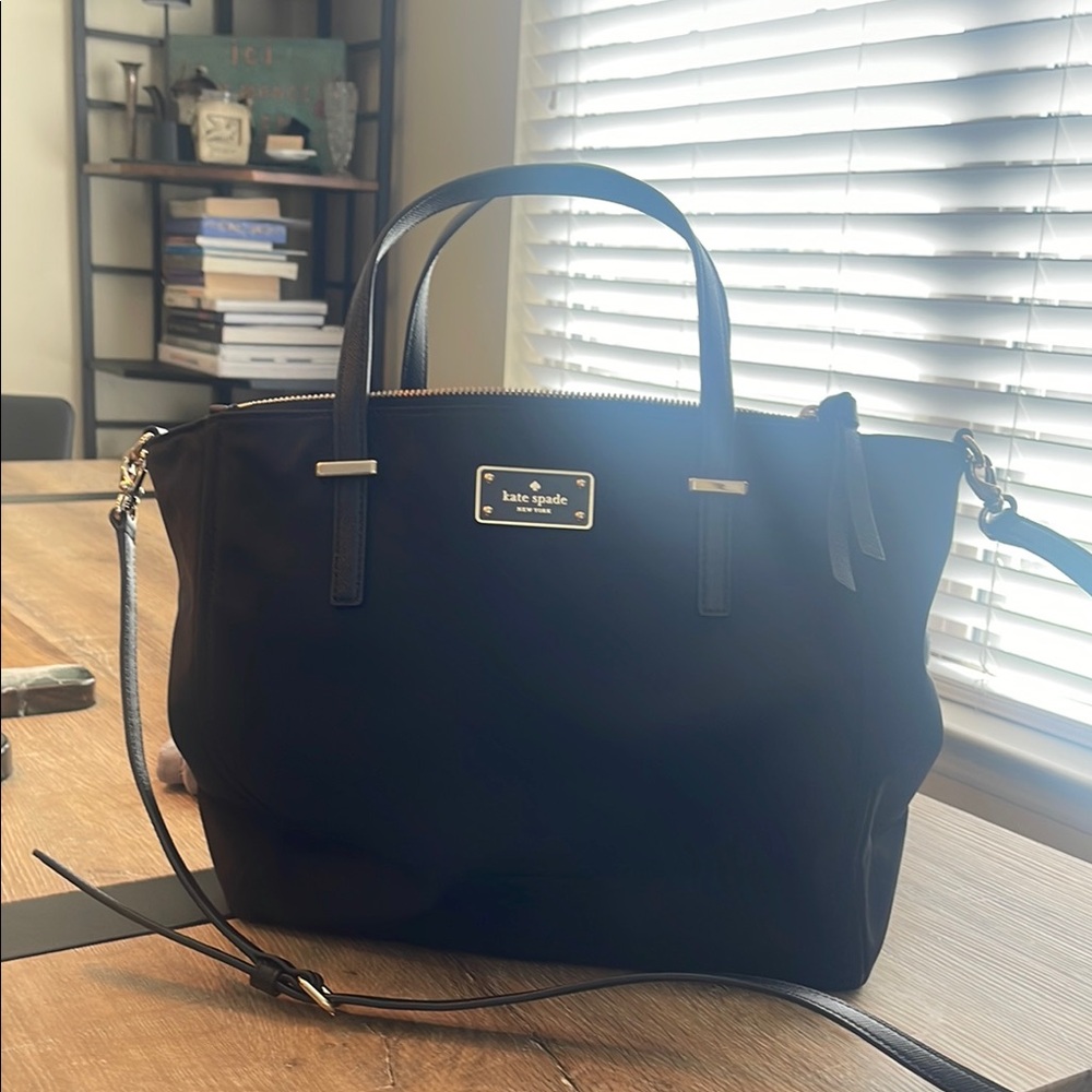 Kate Spade. Minimal use. Nice compartments for organizing. Stylish and chic.